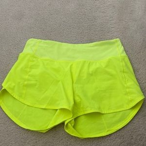 Lululemon Speed Up 4 inch shorts in neon yellow!